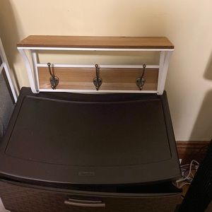 Wall hooks it also has a shelf on top for some of your things